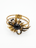Antique Brass Floral Cuff with Faceted Onyx-Tone Center